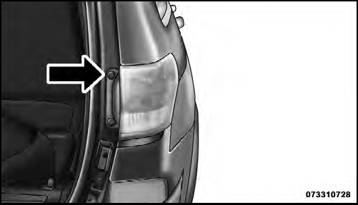 3. Grasp the tail lamp and pull firmly rearward to