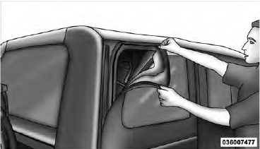 2. Release header latches from the windshield frame.